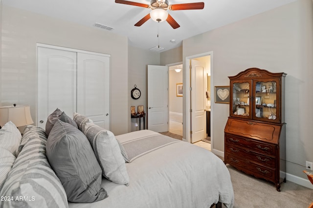 carpeted bedroom featuring ceiling fan and a closet