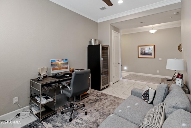 office space featuring ceiling fan and crown molding