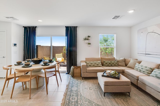 living area featuring recessed lighting, visible vents, and plenty of natural light