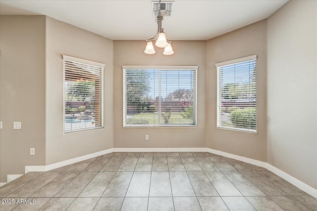 18207 W Sells Dr, Goodyear, AZ 85395 - unfurnished dining area with healthy amount of natural light and a chandelier
