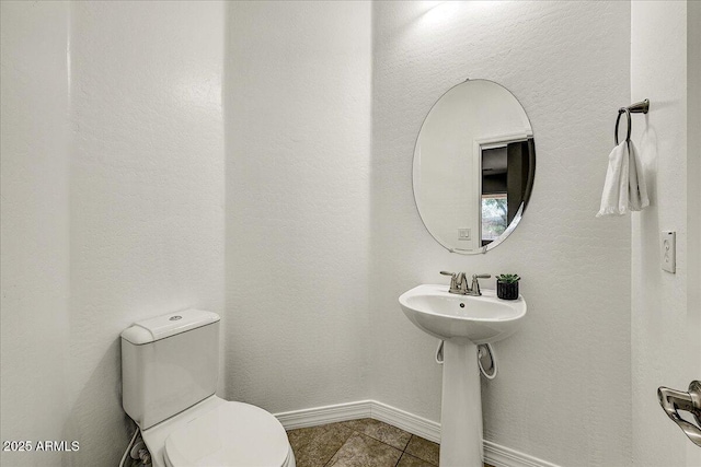18207 W Sells Dr, Goodyear, AZ 85395 - half bath featuring tile patterned floors and toilet