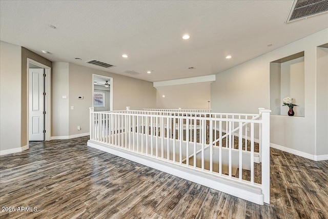 18207 W Sells Dr, Goodyear, AZ 85395 - empty room with wood finished floors and recessed lighting