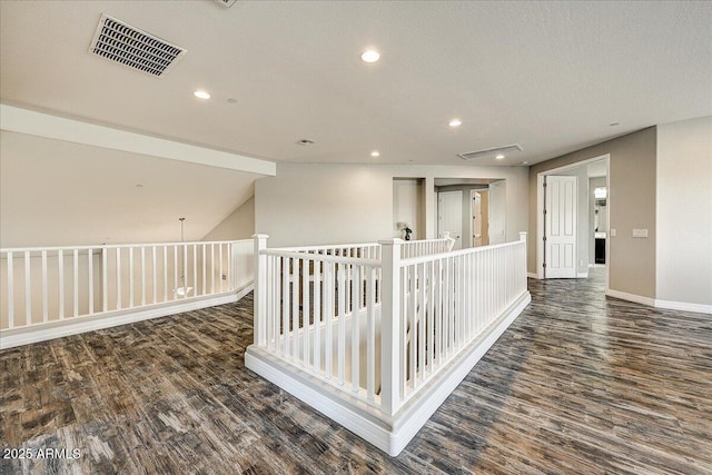 18207 W Sells Dr, Goodyear, AZ 85395 - hallway featuring wood finished floors and recessed lighting
