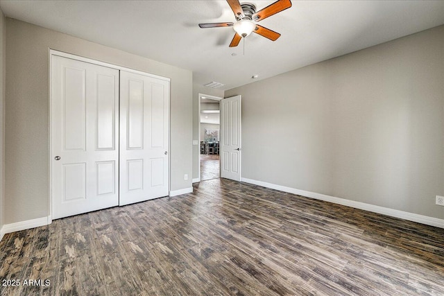 18207 W Sells Dr, Goodyear, AZ 85395 - unfurnished bedroom featuring wood finished floors, a closet, and a ceiling fan