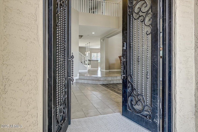 18207 W Sells Dr, Goodyear, AZ 85395 - tiled entryway with stairway and a textured wall