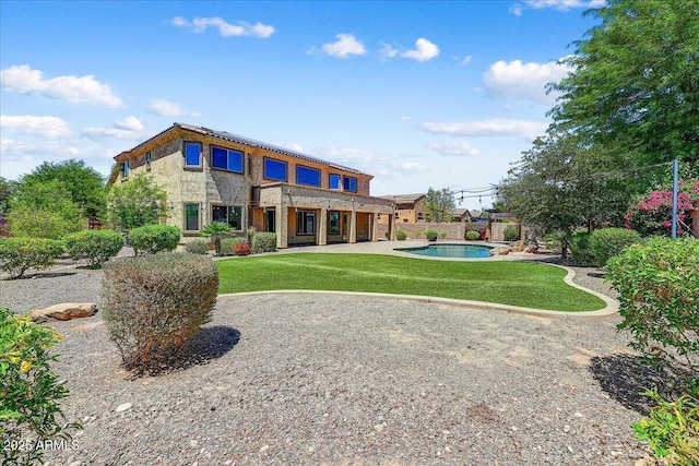 18207 W Sells Dr, Goodyear, AZ 85395 - rear view of property with an outdoor pool, a yard, and a patio area