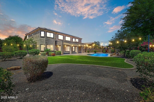 18207 W Sells Dr, Goodyear, AZ 85395 - back of house featuring a patio area and a fenced backyard