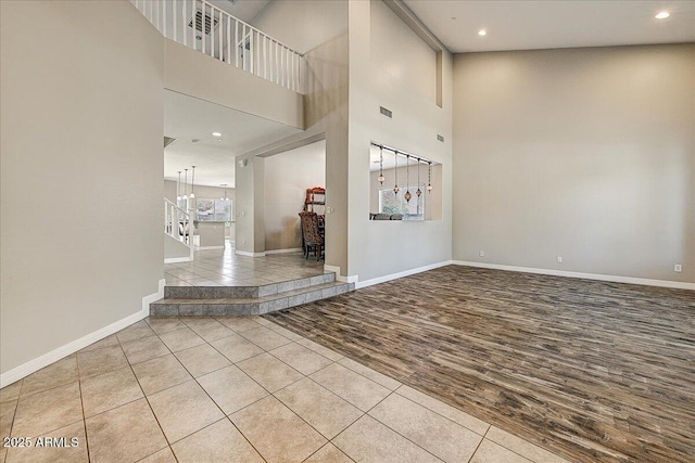 18207 W Sells Dr, Goodyear, AZ 85395 - entrance foyer featuring wood finished floors, recessed lighting, and a high ceiling