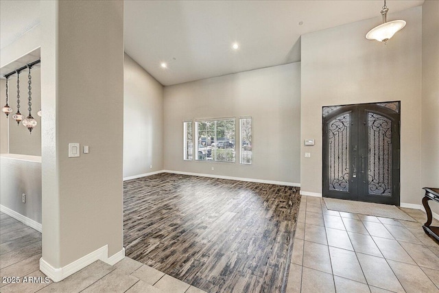 18207 W Sells Dr, Goodyear, AZ 85395 - foyer featuring wood finished floors, recessed lighting, and a towering ceiling