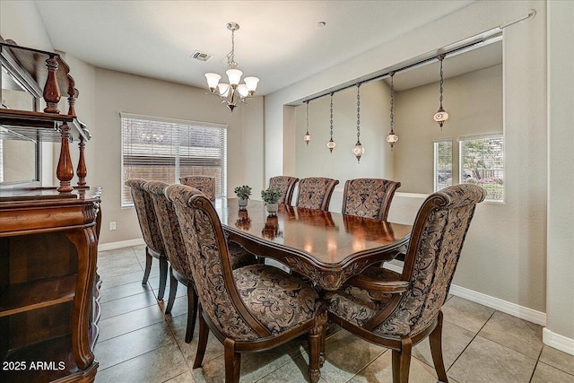 18207 W Sells Dr, Goodyear, AZ 85395 - dining space featuring a chandelier and light tile patterned floors