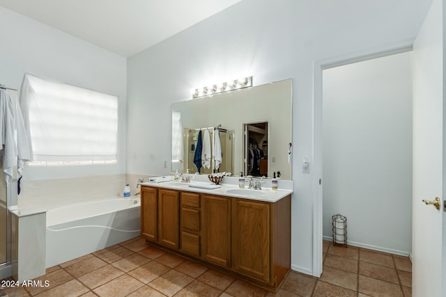 bathroom featuring vanity and a tub