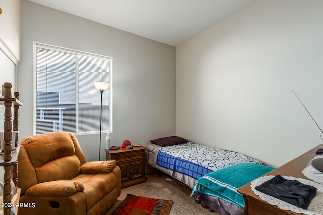 carpeted bedroom with vaulted ceiling