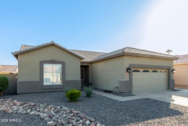 single story home featuring a garage