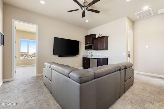 1899 Kensington Ct, Prescott, AZ 86301 - living room featuring wet bar, visible vents, light carpet, and recessed lighting