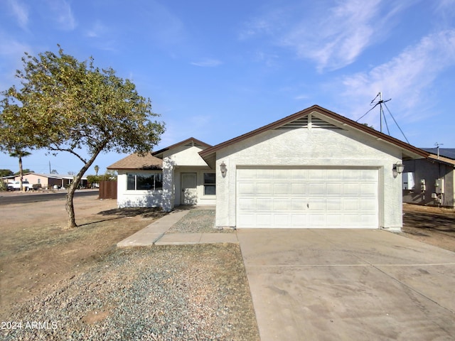 single story home featuring a garage