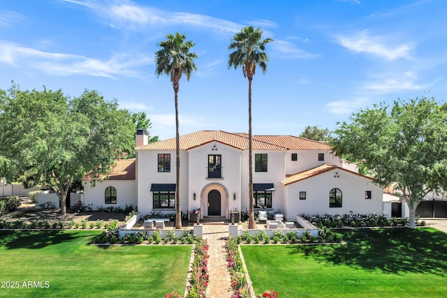 2339 E Virgo Pl, Chandler, AZ 85249 - mediterranean / spanish-style home with a tiled roof, a chimney, stucco siding, and a front lawn