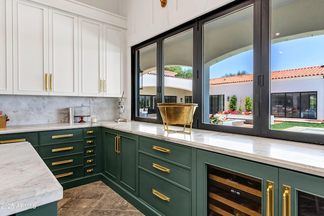 2339 E Virgo Pl, Chandler, AZ 85249 - kitchen with green cabinetry, white cabinetry, light stone counters, and wine cooler