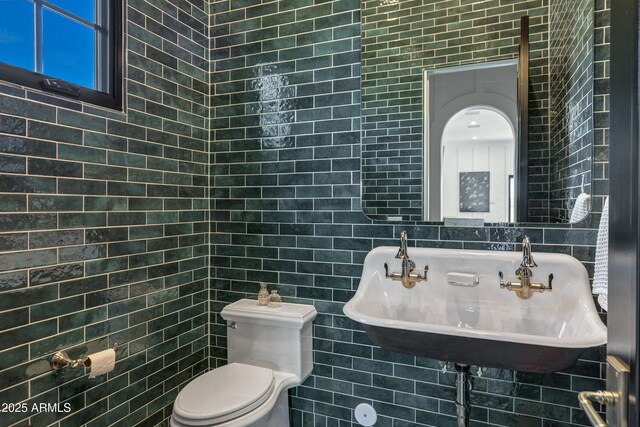 2339 E Virgo Pl, Chandler, AZ 85249 - bathroom featuring a sink, toilet, and tile walls