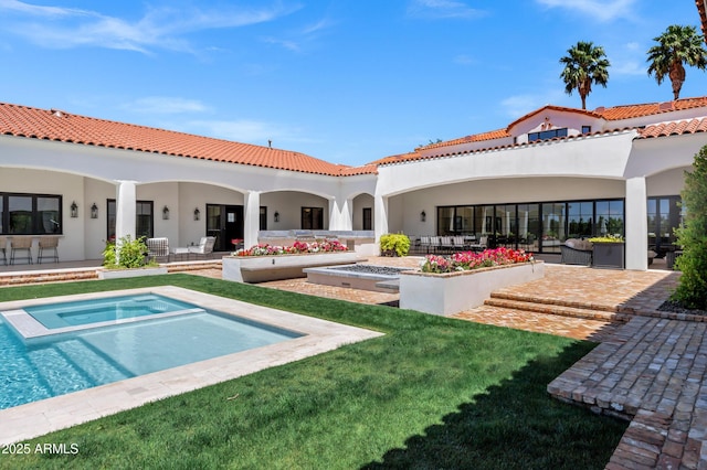 2339 E Virgo Pl, Chandler, AZ 85249 - back of house with an in-ground hot tub, stucco siding, a patio, and a tile roof