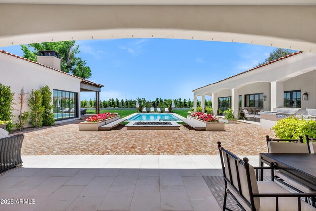 2339 E Virgo Pl, Chandler, AZ 85249 - outdoor pool with area for grilling, a patio, outdoor dining space, and a jacuzzi