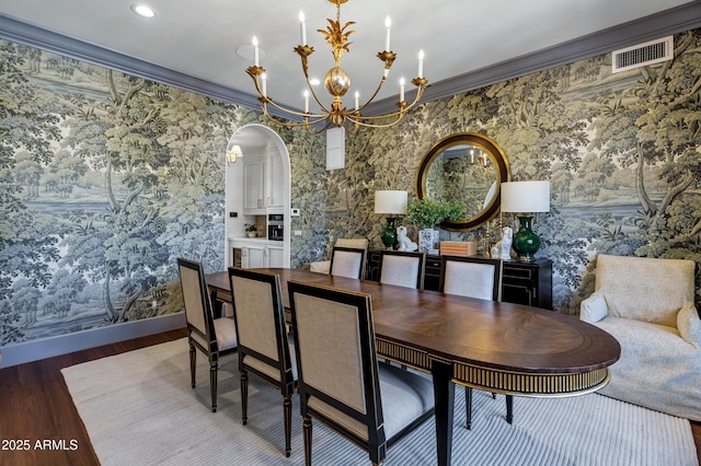 2339 E Virgo Pl, Chandler, AZ 85249 - dining room with a chandelier, wallpapered walls, wood finished floors, arched walkways, and baseboards