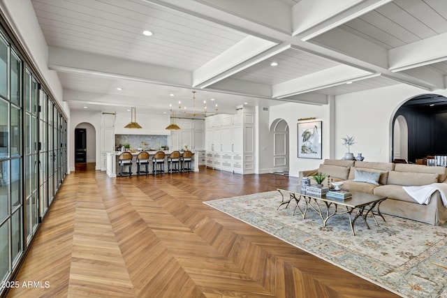 2339 E Virgo Pl, Chandler, AZ 85249 - living room with arched walkways, recessed lighting, beam ceiling, and baseboards
