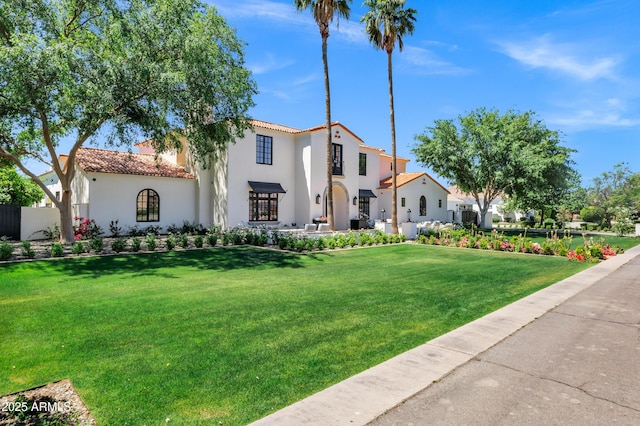 2339 E Virgo Pl, Chandler, AZ 85249 - mediterranean / spanish home with a tile roof, stucco siding, and a front yard