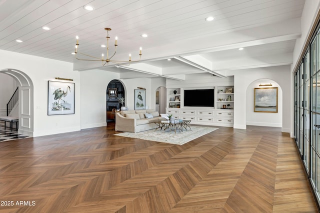 2339 E Virgo Pl, Chandler, AZ 85249 - living area with arched walkways, baseboards, recessed lighting, a chandelier, and beamed ceiling