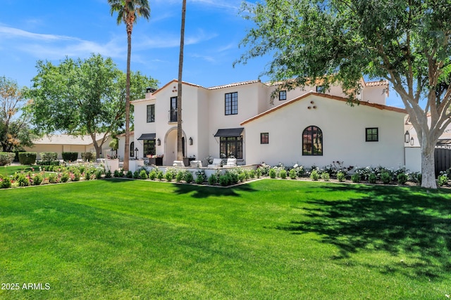 2339 E Virgo Pl, Chandler, AZ 85249 - mediterranean / spanish home featuring stucco siding, a front yard, and a chimney