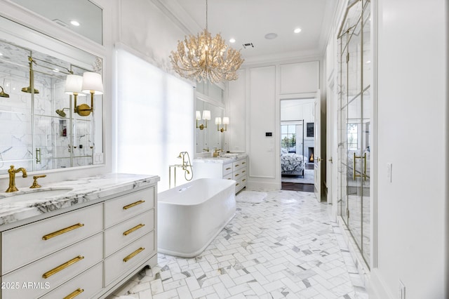 2339 E Virgo Pl, Chandler, AZ 85249 - ensuite bathroom with a chandelier, a marble finish shower, two vanities, ornamental molding, and a freestanding tub