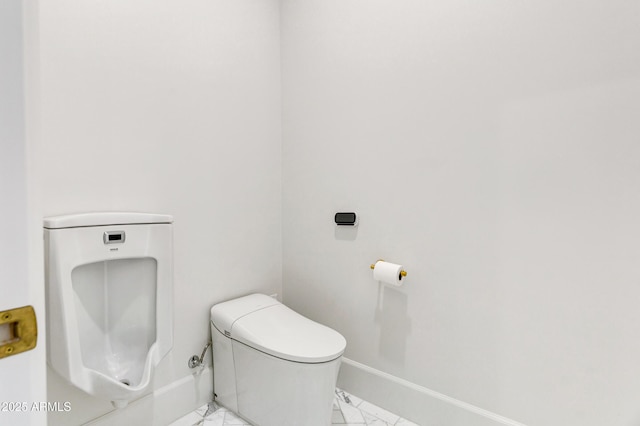 2339 E Virgo Pl, Chandler, AZ 85249 - bathroom featuring marble look tile flooring, toilet, and baseboards