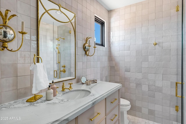 2339 E Virgo Pl, Chandler, AZ 85249 - bathroom with tile walls, a shower stall, vanity, and toilet