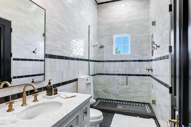 2339 E Virgo Pl, Chandler, AZ 85249 - full bathroom featuring a stall shower, toilet, vanity, and tile walls