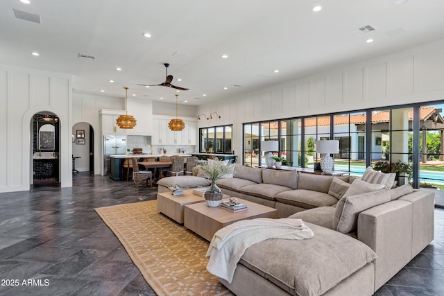 2339 E Virgo Pl, Chandler, AZ 85249 - living room with arched walkways, plenty of natural light, a ceiling fan, and recessed lighting