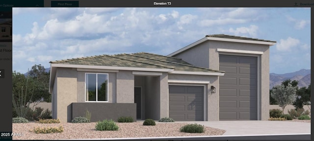 view of front of home featuring concrete driveway, an attached garage, and stucco siding