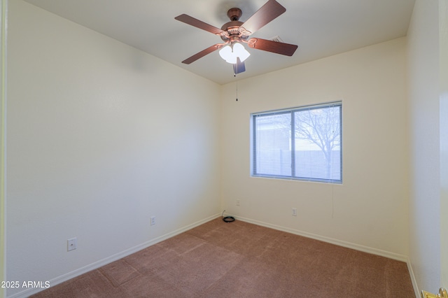 empty room with ceiling fan and light colored carpet