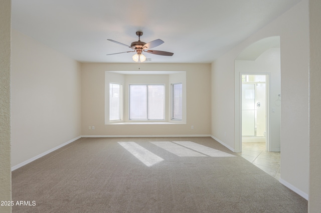 empty room with light carpet and ceiling fan