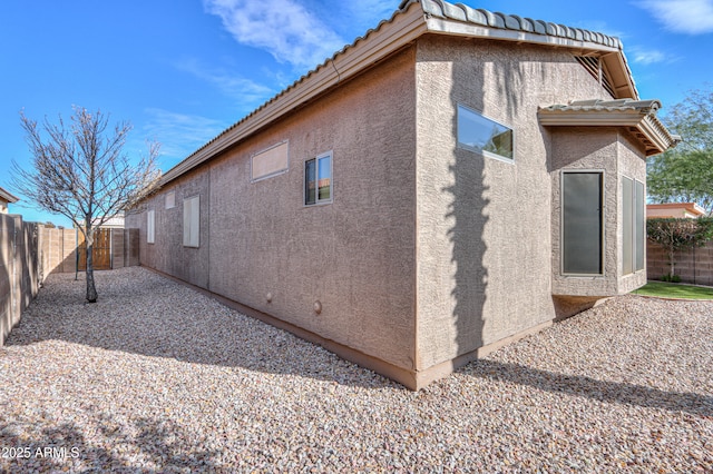 view of side of home featuring a patio