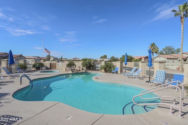 view of swimming pool with a patio area