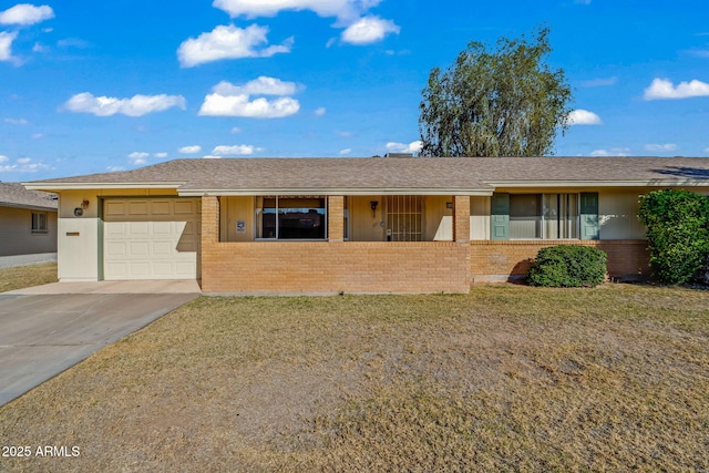 ranch-style home with a front yard and a garage