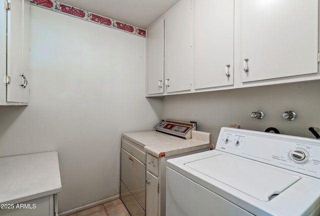 washroom with light tile patterned flooring and cabinets