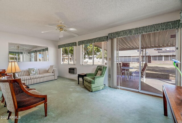 sunroom / solarium featuring ceiling fan and heating unit