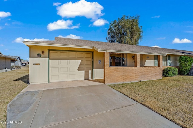 ranch-style home featuring a front yard and a garage