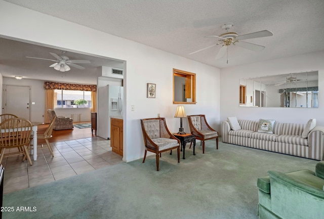 carpeted living room featuring a textured ceiling