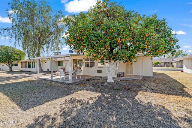 back of property featuring a patio