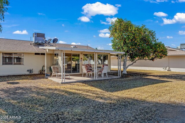 back of house with a yard, central AC, and a patio area