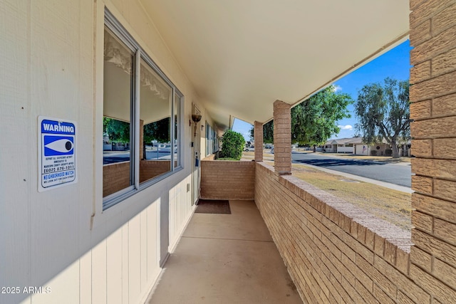 view of patio featuring a balcony