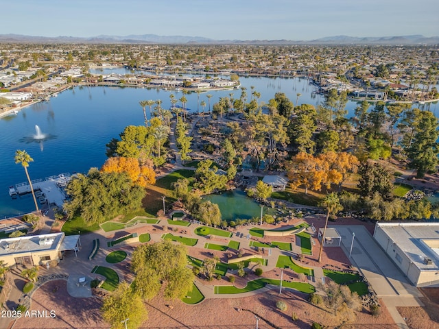 drone / aerial view featuring a water and mountain view