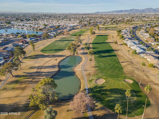 drone / aerial view with a water and mountain view