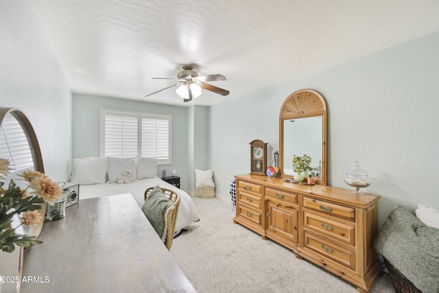 bedroom with light colored carpet and ceiling fan
